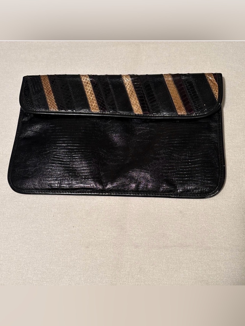 Oleg Cassini vintage Black clutch with gold stripes & textured snakeskin patten